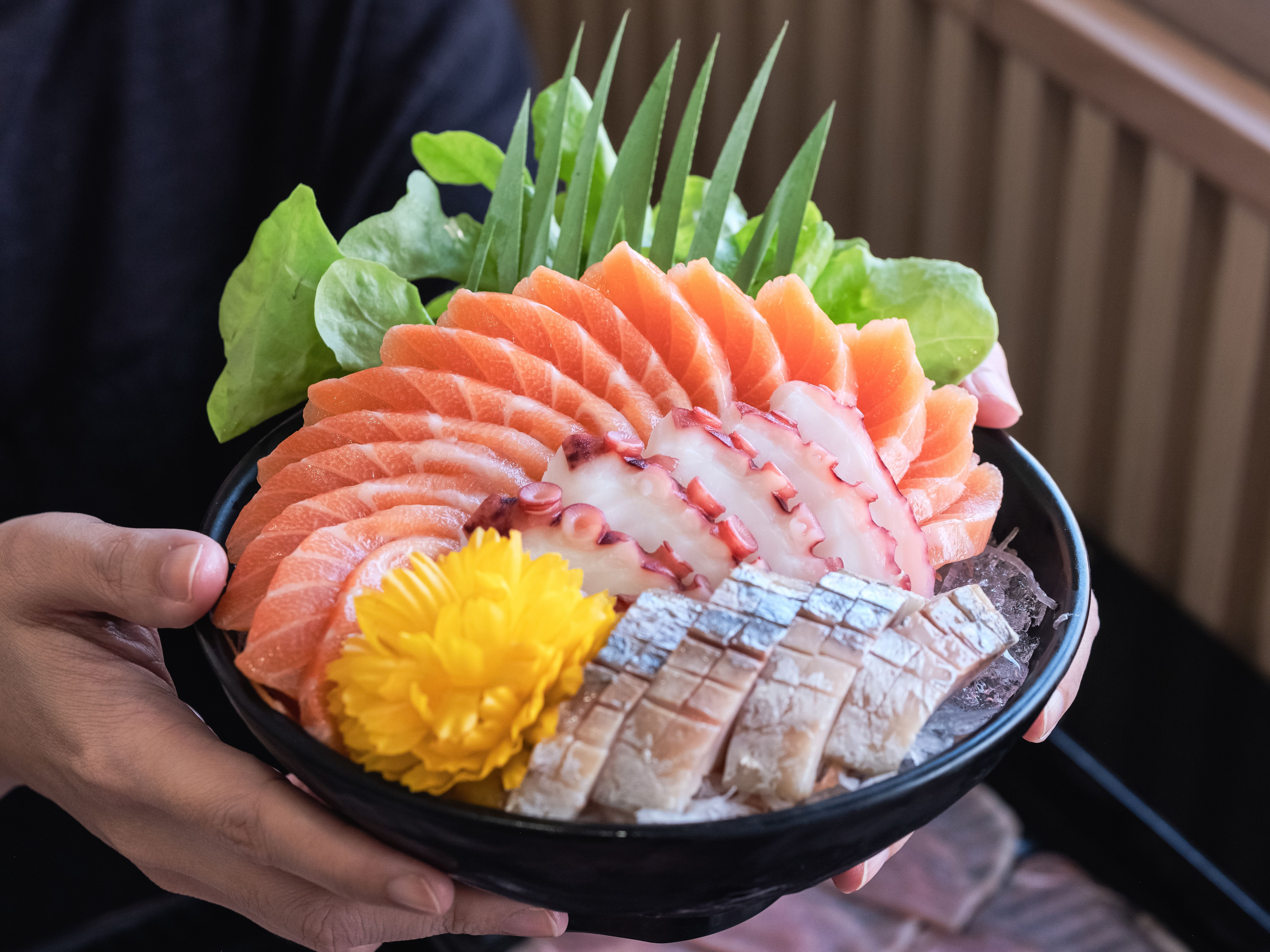 Seafood bowl with sashimi and garnish